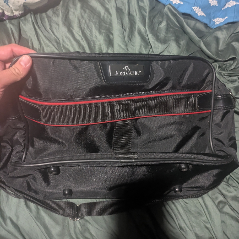 Jordache Black and Red Duffel Bag Sleek Durable Travel Essential